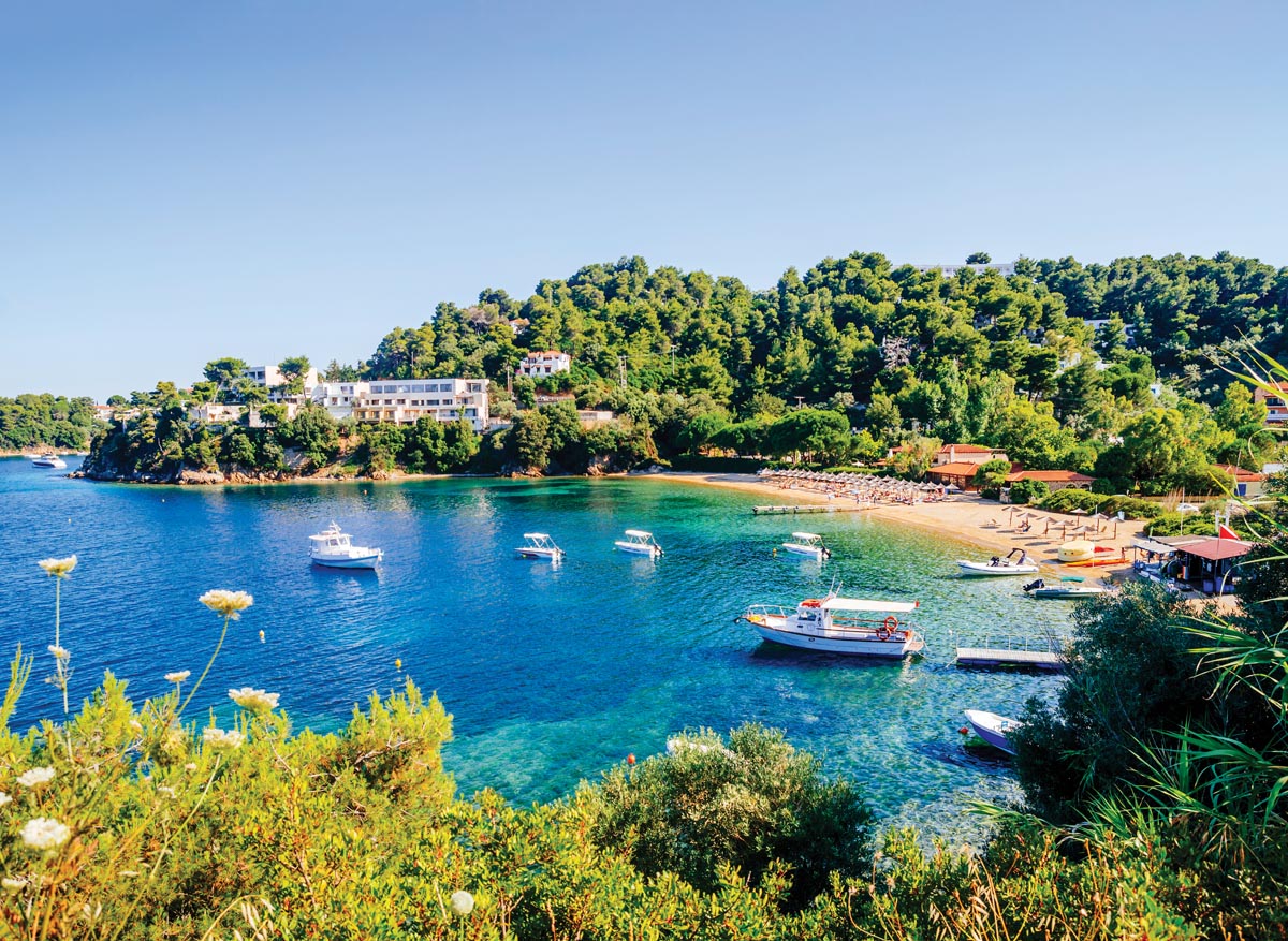 Whitewashed buildings overlooking the deep blue Aegean Sea in the Greek Islands